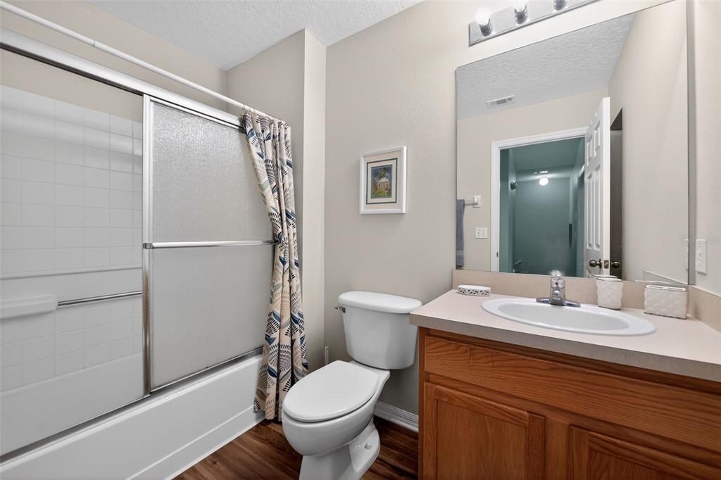 8538 Crystal Cove Loop Kissimmee, FL 34747 - Photo 23 of 59 a bathroom with a sink toilet and shower