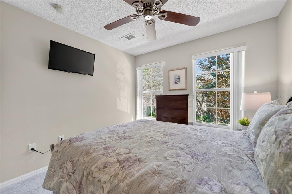 8538 Crystal Cove Loop Kissimmee, FL 34747 - Photo 25 of 59 a bed room with a bed and a television