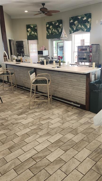 8538 Crystal Cove Loop Kissimmee, FL 34747 - Photo 36 of 59 a kitchen with stainless steel appliances kitchen island granite countertop a sink and cabinets