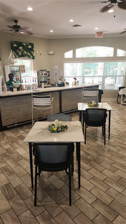 8538 Crystal Cove Loop Kissimmee, FL 34747 - Photo 38 of 59 a dining table with chairs and window