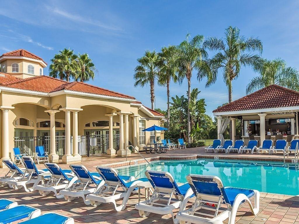 8538 Crystal Cove Loop Kissimmee, FL 34747 - Photo 58 of 59 a group of people sitting in front of a cafe