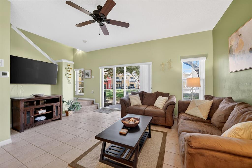 8538 Crystal Cove Loop Kissimmee, FL 34747 - Photo 10 of 59 a living room with furniture and a flat screen tv