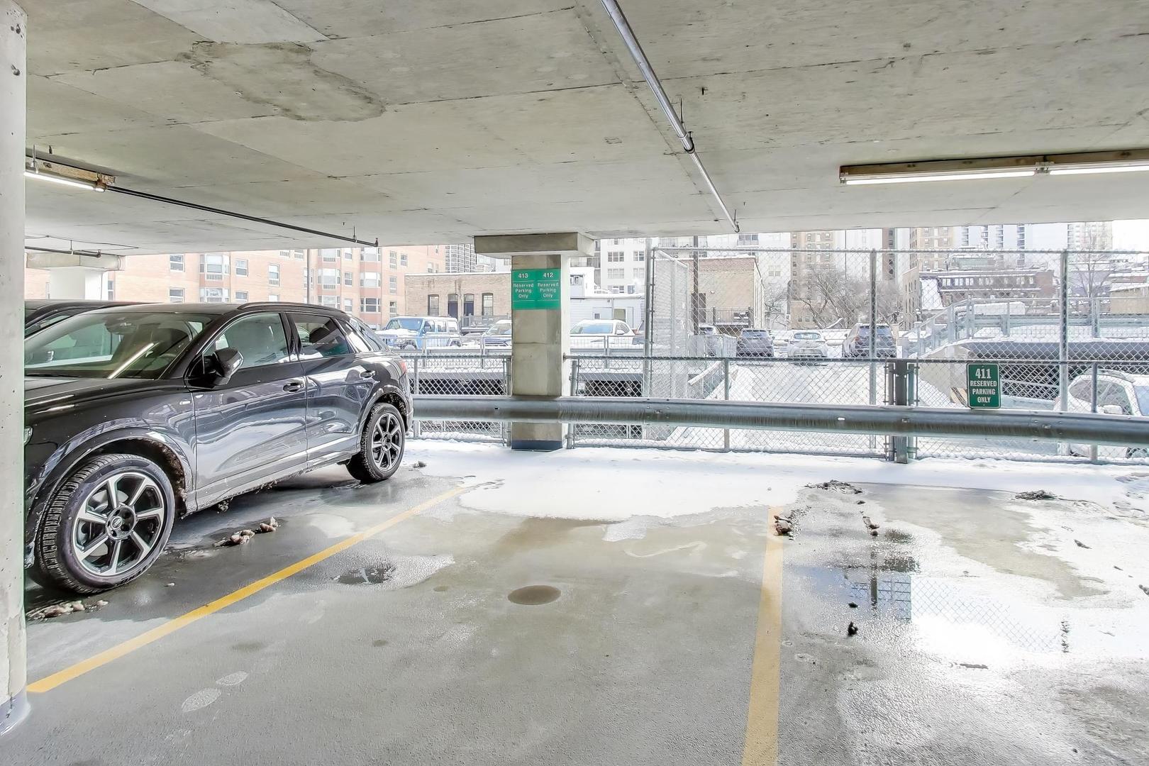 33 West Delaware Place, Unit 12K Chicago, IL 60610 - Photo 20 of 21 a view of a car in a parking garage