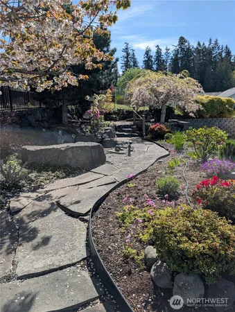 a view of a water pond with sitting area