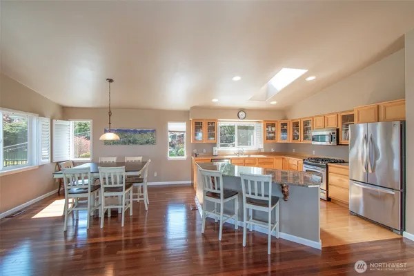 a view of a dining room with furniture window and wooden floor