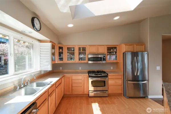a kitchen with a refrigerator and a sink