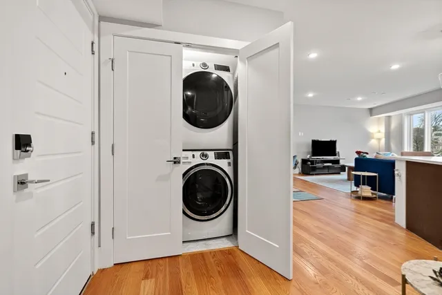 a view of a hallway with washer and dryer