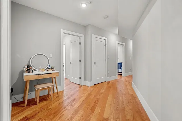 a view of a hardwood floor and a sink in a room