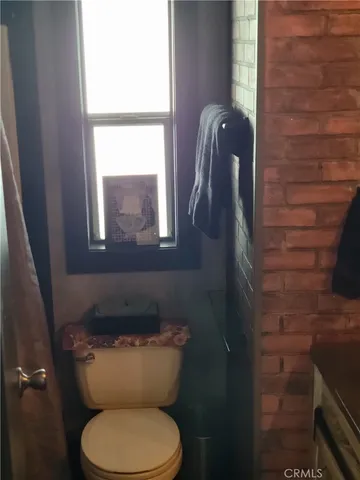 a bedroom with a bed and a mirror