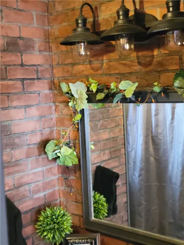 a bedroom with bed and a window