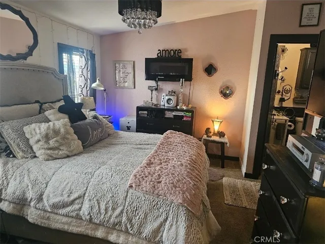 a bathroom with a toilet and a mirror