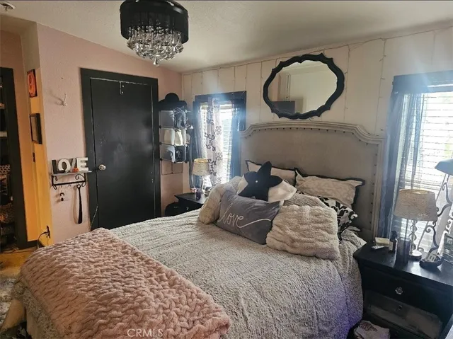 a living room with furniture and a mirror