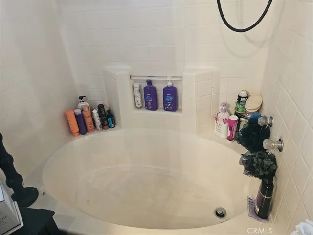 a living room with stainless steel appliances kitchen island granite countertop furniture and a kitchen view