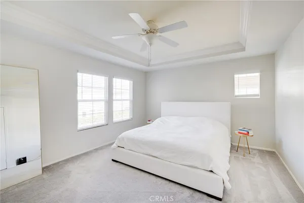 a bathroom with a double vanity sink window and a bathtub