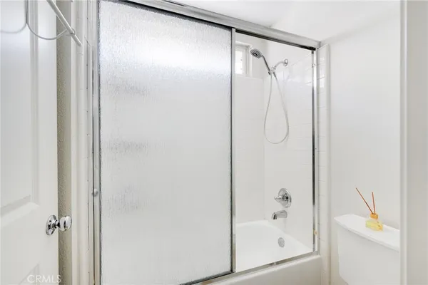 a view of an empty room with windows