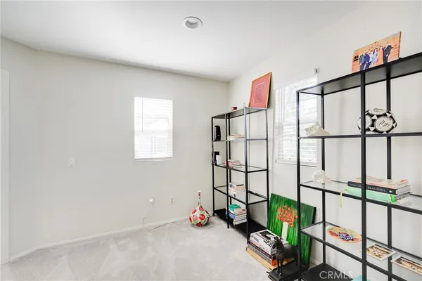 a view of a patio with couches and potted plants