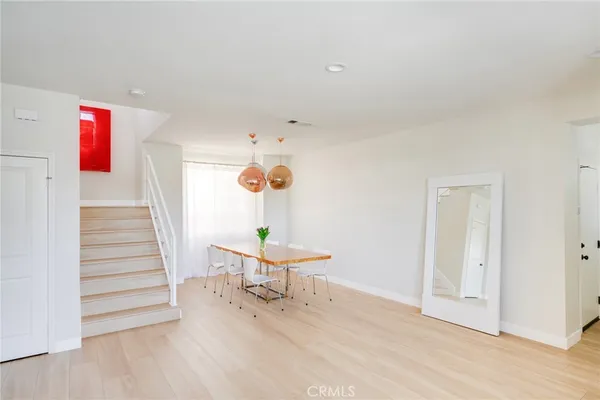 a view of a living room and entryway