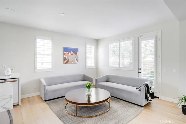 a kitchen with stainless steel appliances a refrigerator a stove a sink and a window