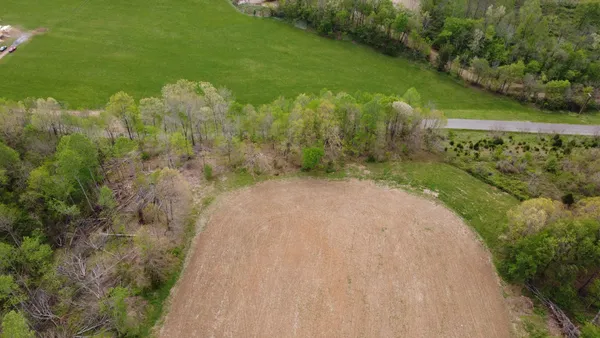 a view of a pathway both side of yard with green space