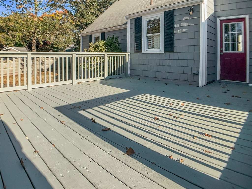 444 Lowell Street Reading, MA 01867 - Photo 36 of 38 a view of a wooden deck