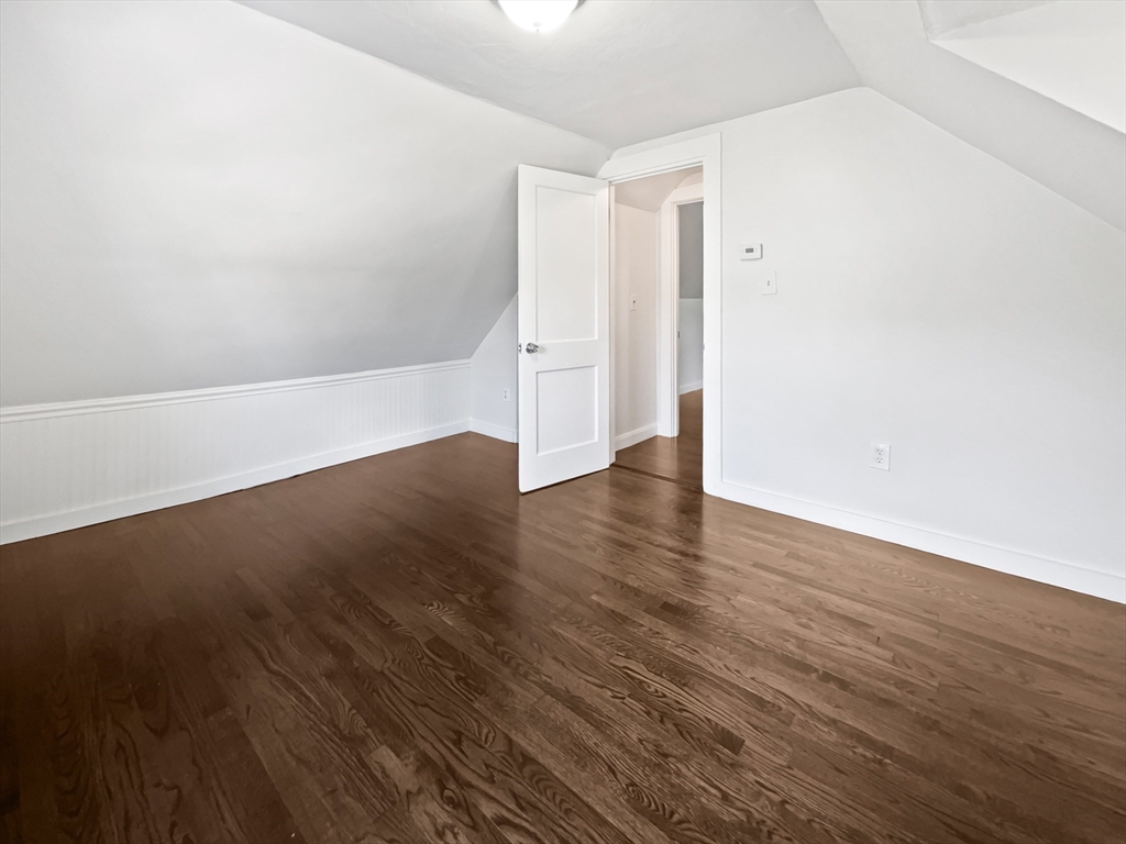 444 Lowell Street Reading, MA 01867 - Photo 5 of 38 an empty room with wooden floor