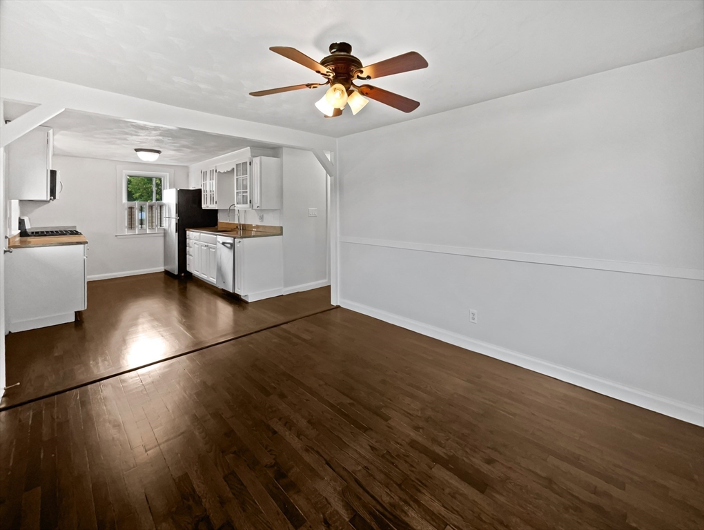 444 Lowell Street Reading, MA 01867 - Photo 10 of 38 a view of workspace with wooden floor