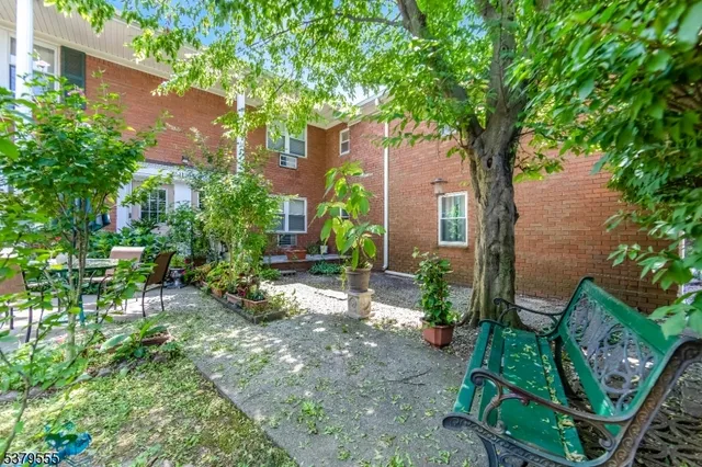 a backyard of a house with outdoor seating