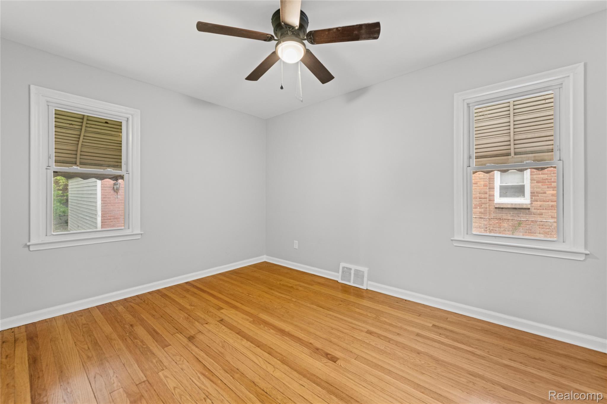 19720 Edinborough Road Detroit, MI 48219 - Photo 14 of 30 Unfurnished room with wood-type flooring and ceiling fan