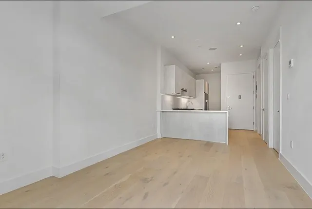 a view of kitchen with wooden floor