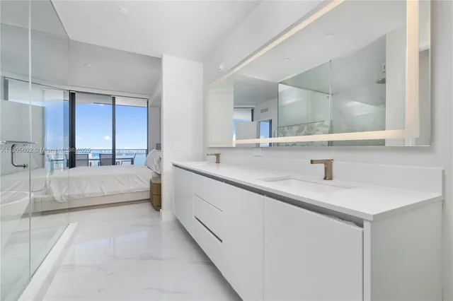 a bathroom with a toilet and a vanity