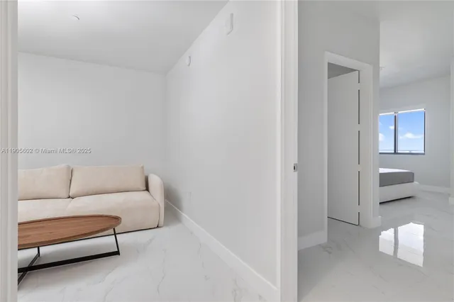 a view of a hallway with white walls