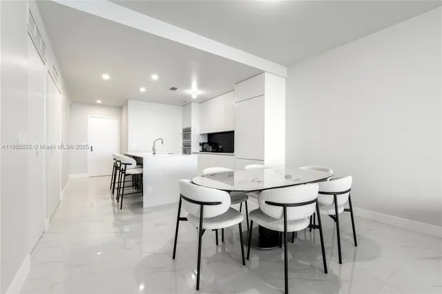 a bedroom with a large bed and a large window