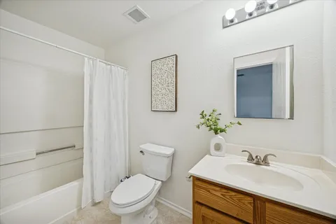 a bathroom with a toilet a sink and a bathtub