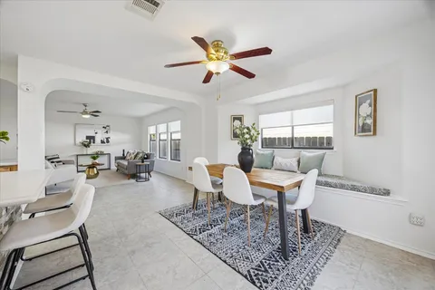 a living room with furniture a window and a rug