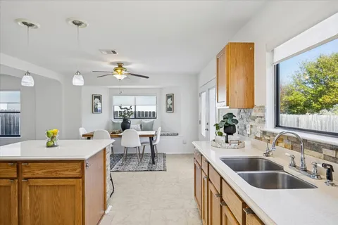 a kitchen with a sink and a refrigerator