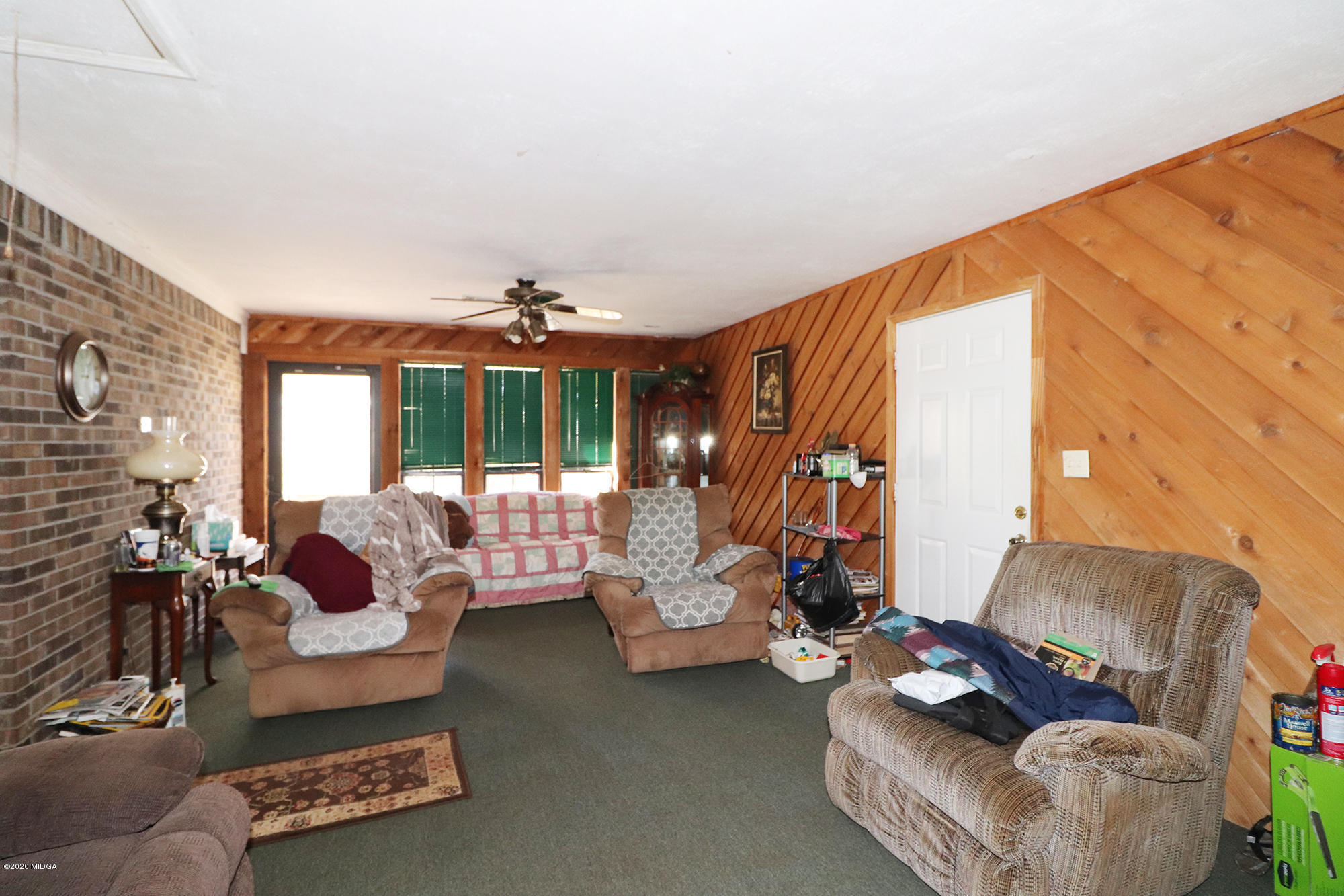 48 Grace Road Knoxville, GA 31050 - Photo 13 of 62 a living room with furniture and a large window