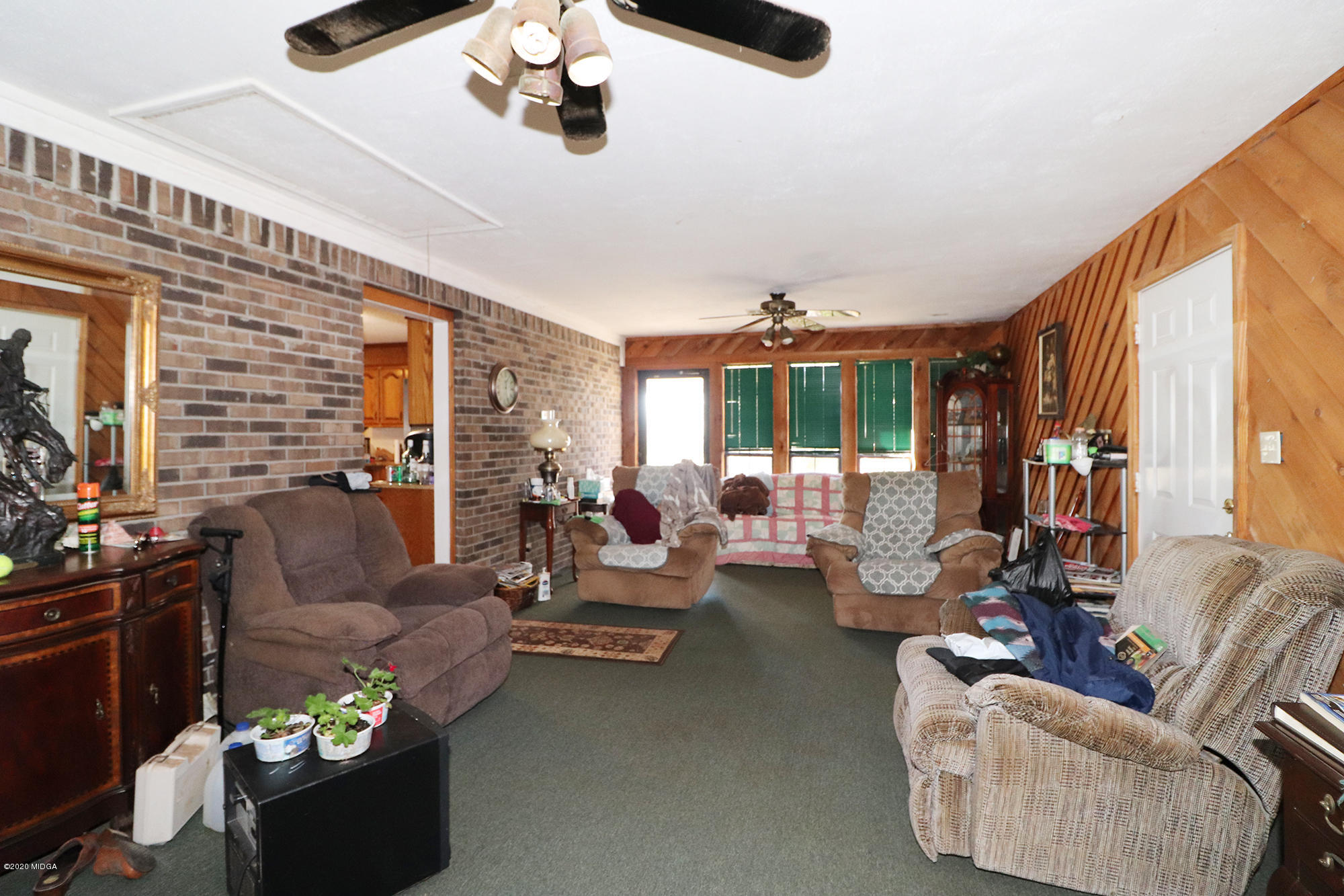 48 Grace Road Knoxville, GA 31050 - Photo 14 of 62 a living room with furniture and a flat screen tv
