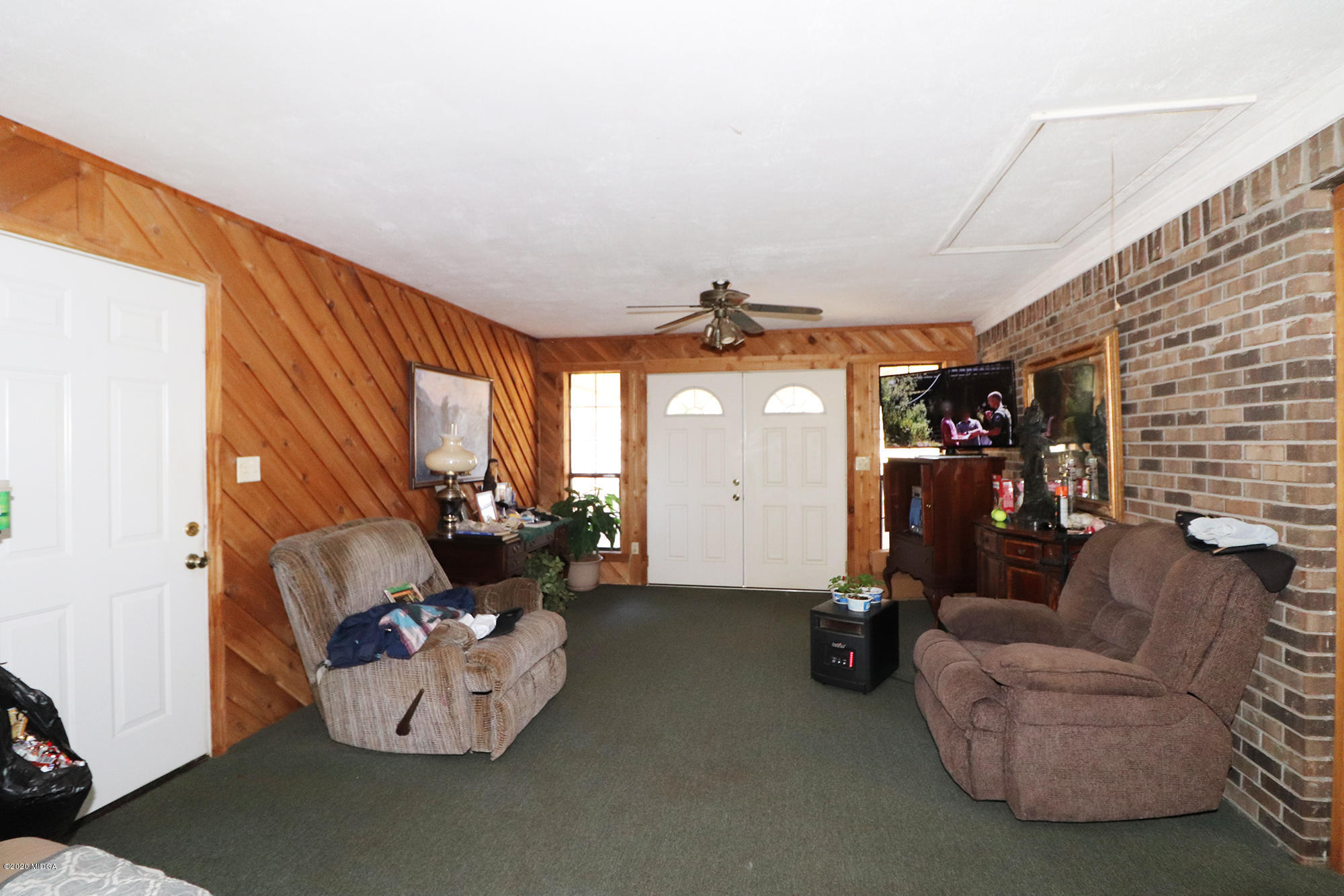 48 Grace Road Knoxville, GA 31050 - Photo 15 of 62 a living room with furniture and a fireplace