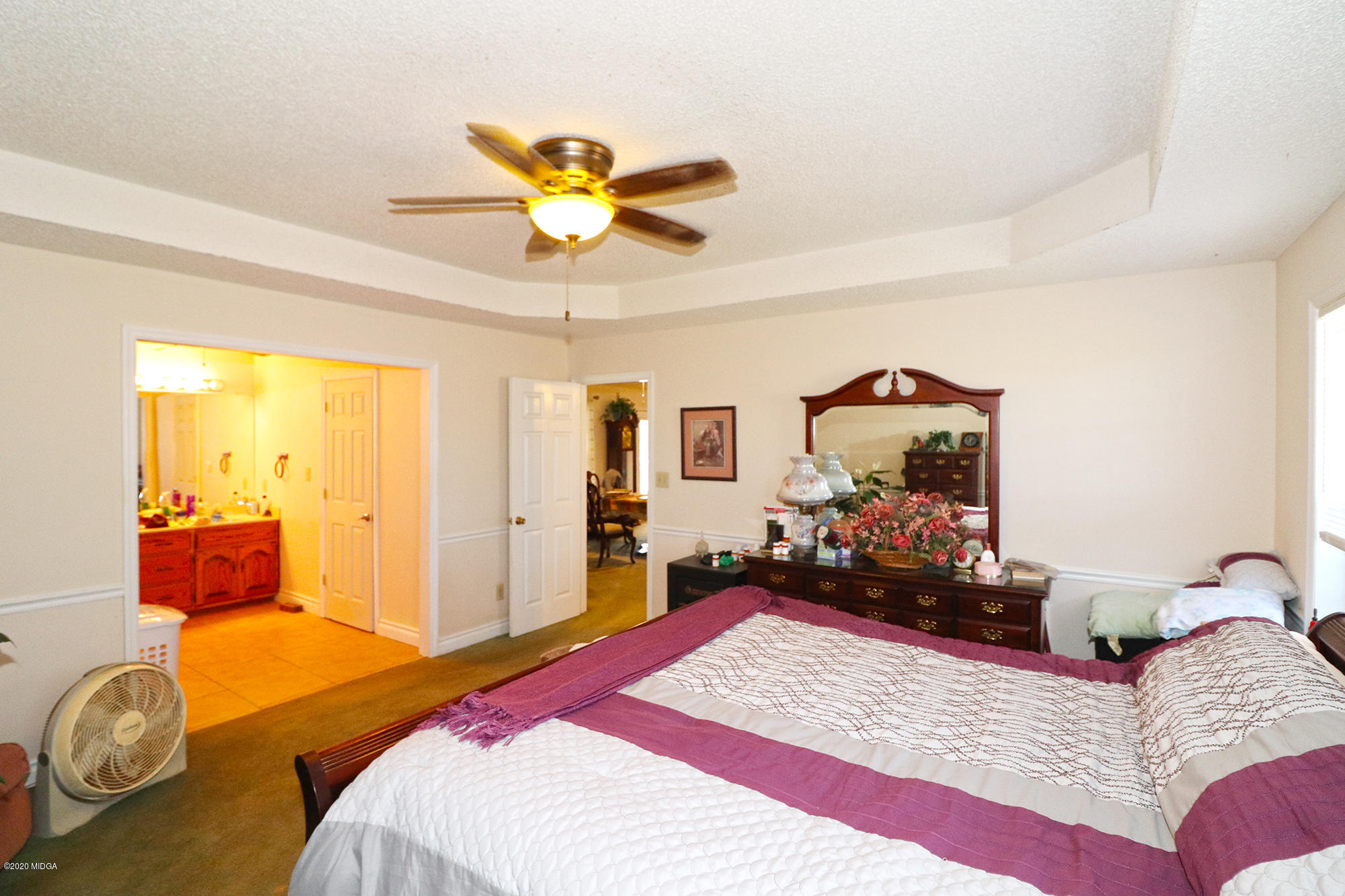 48 Grace Road Knoxville, GA 31050 - Photo 17 of 62 a bedroom with a bed and wooden floor