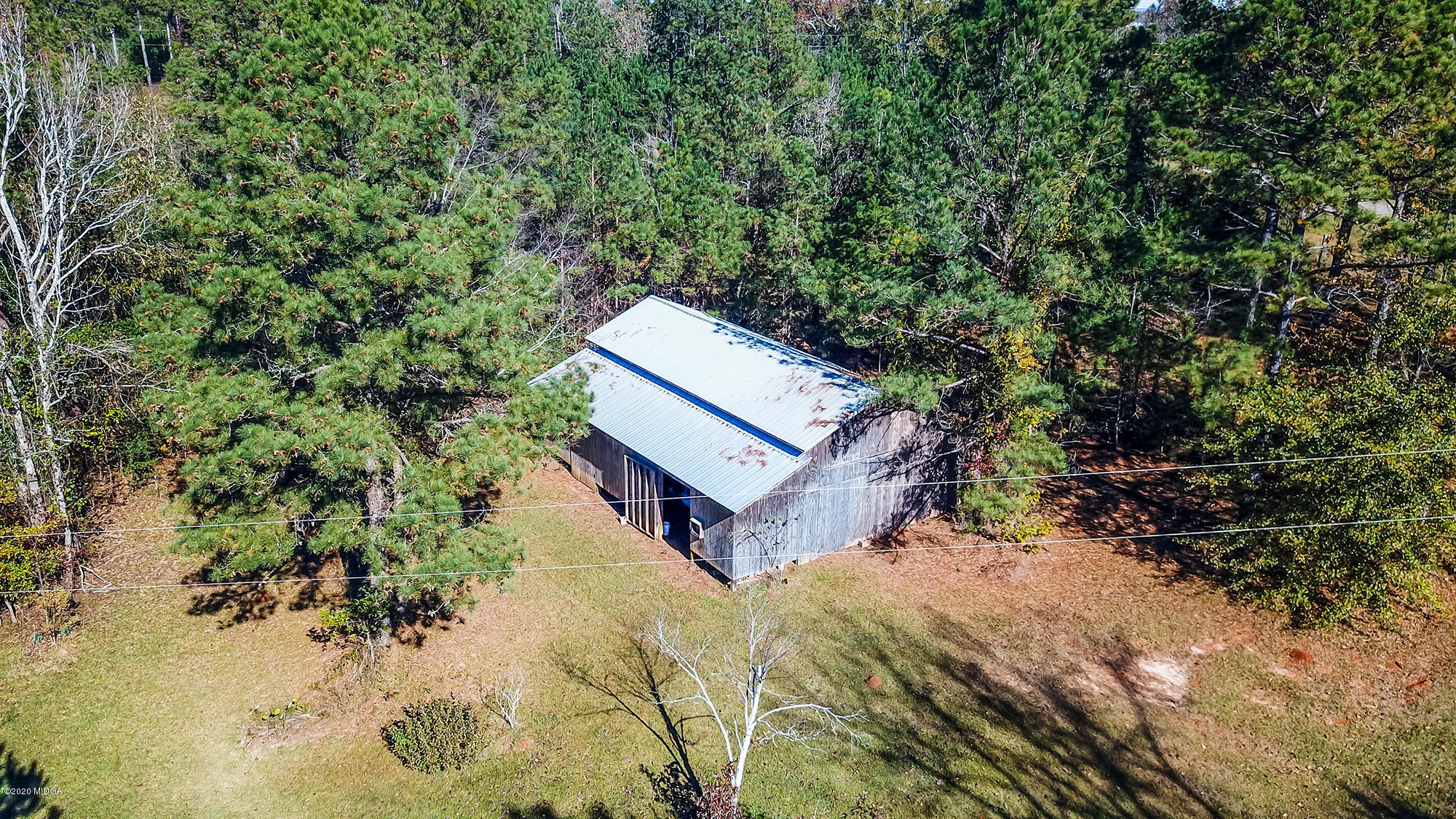 48 Grace Road Knoxville, GA 31050 - Photo 28 of 62 a wooden bench sitting in the middle of a yard