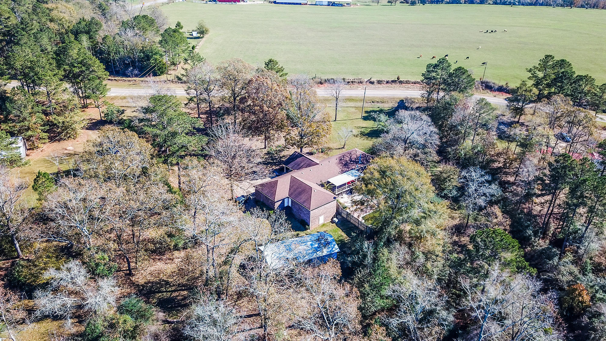 48 Grace Road Knoxville, GA 31050 - Photo 30 of 62 an aerial view of a house with a yard and lake view