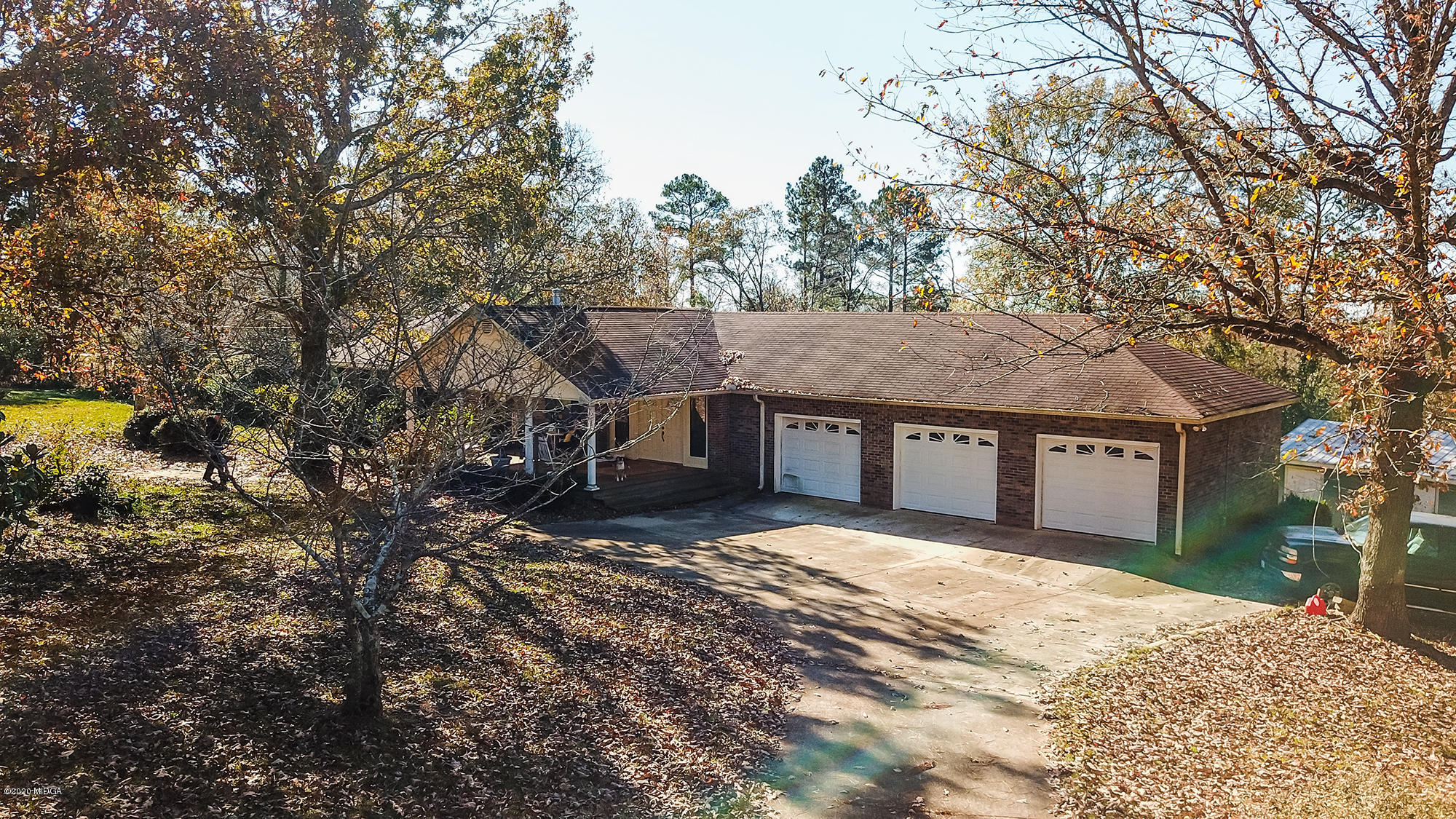 48 Grace Road Knoxville, GA 31050 - Photo 40 of 62 a front view of a house with a yard and garage