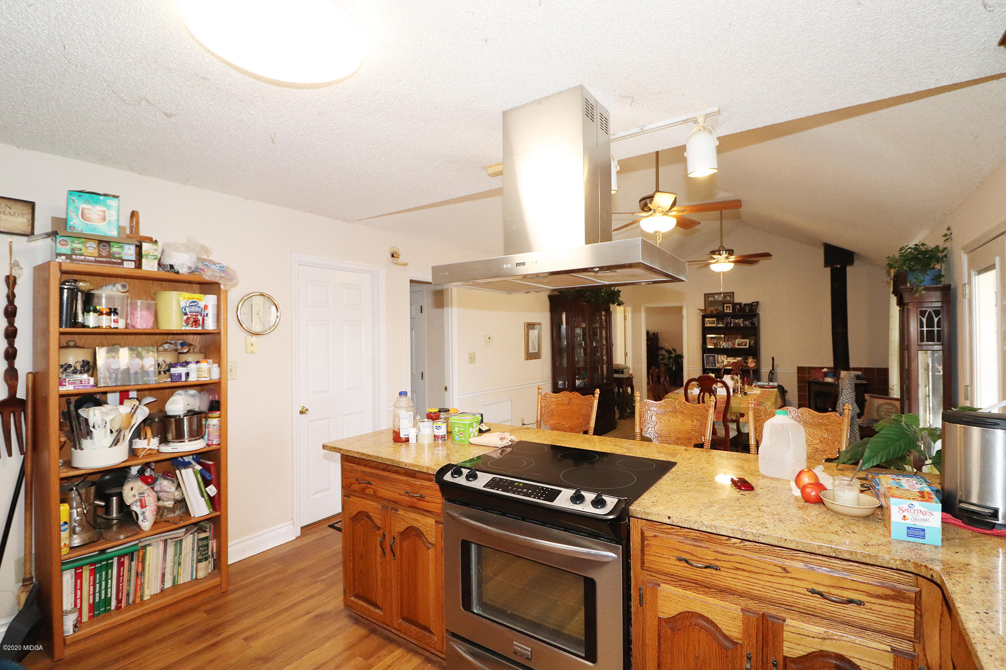 48 Grace Road Knoxville, GA 31050 - Photo 5 of 62 a kitchen with stainless steel appliances granite countertop a stove and cabinets