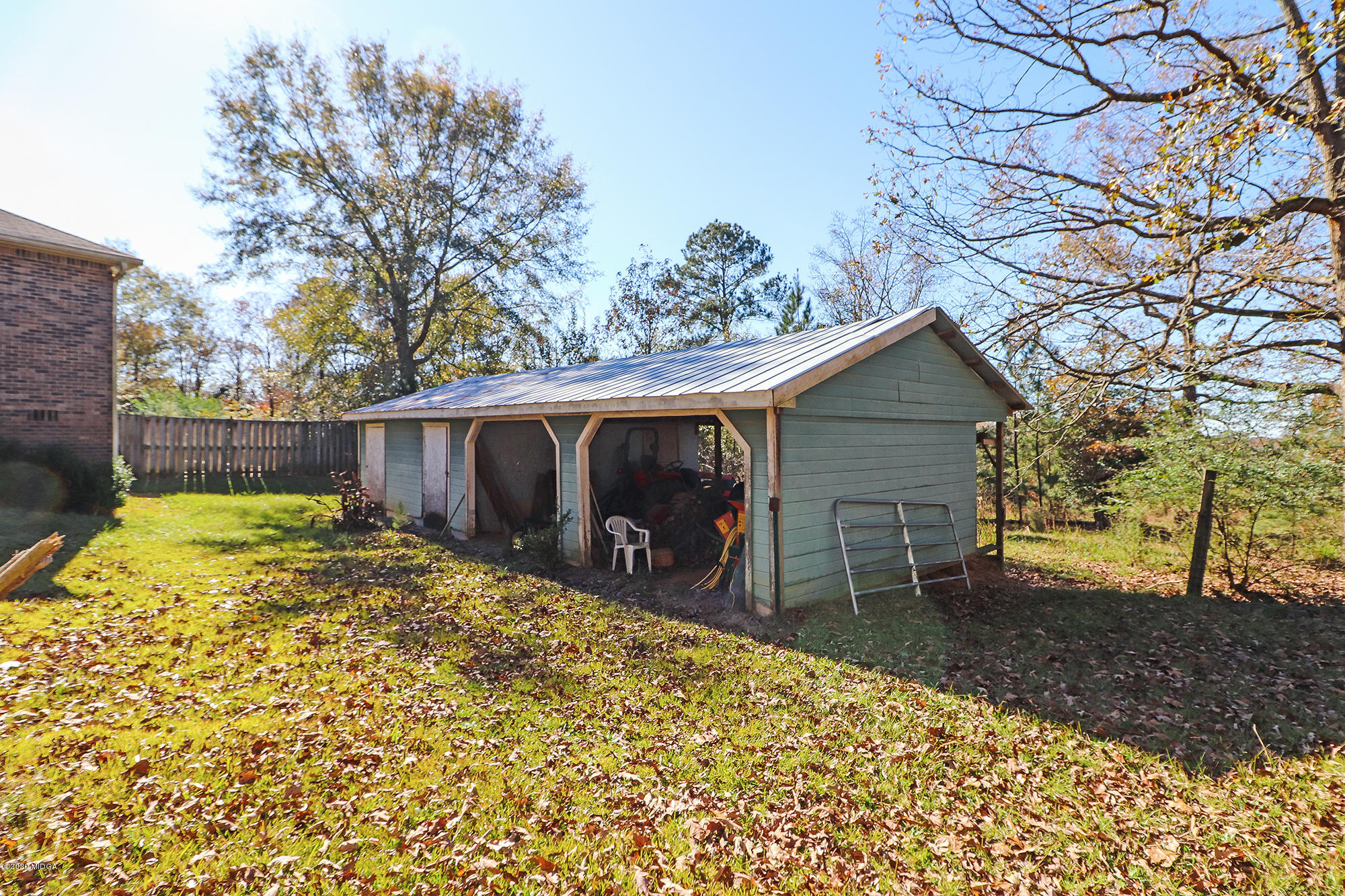 48 Grace Road Knoxville, GA 31050 - Photo 42 of 62 a view of a backyard that has a tree on the side of it