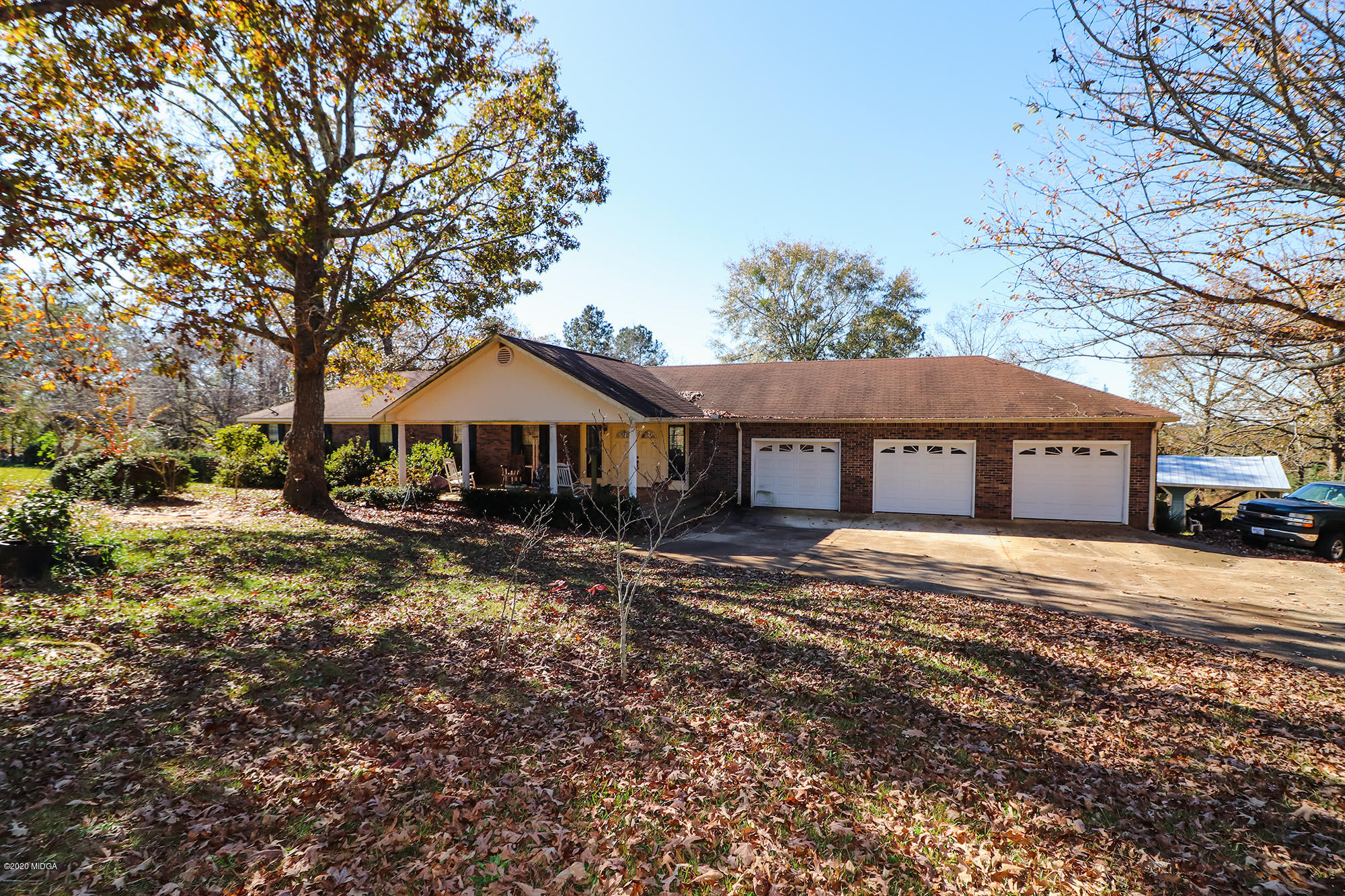 48 Grace Road Knoxville, GA 31050 - Photo 51 of 62 a front view of a house with a garden