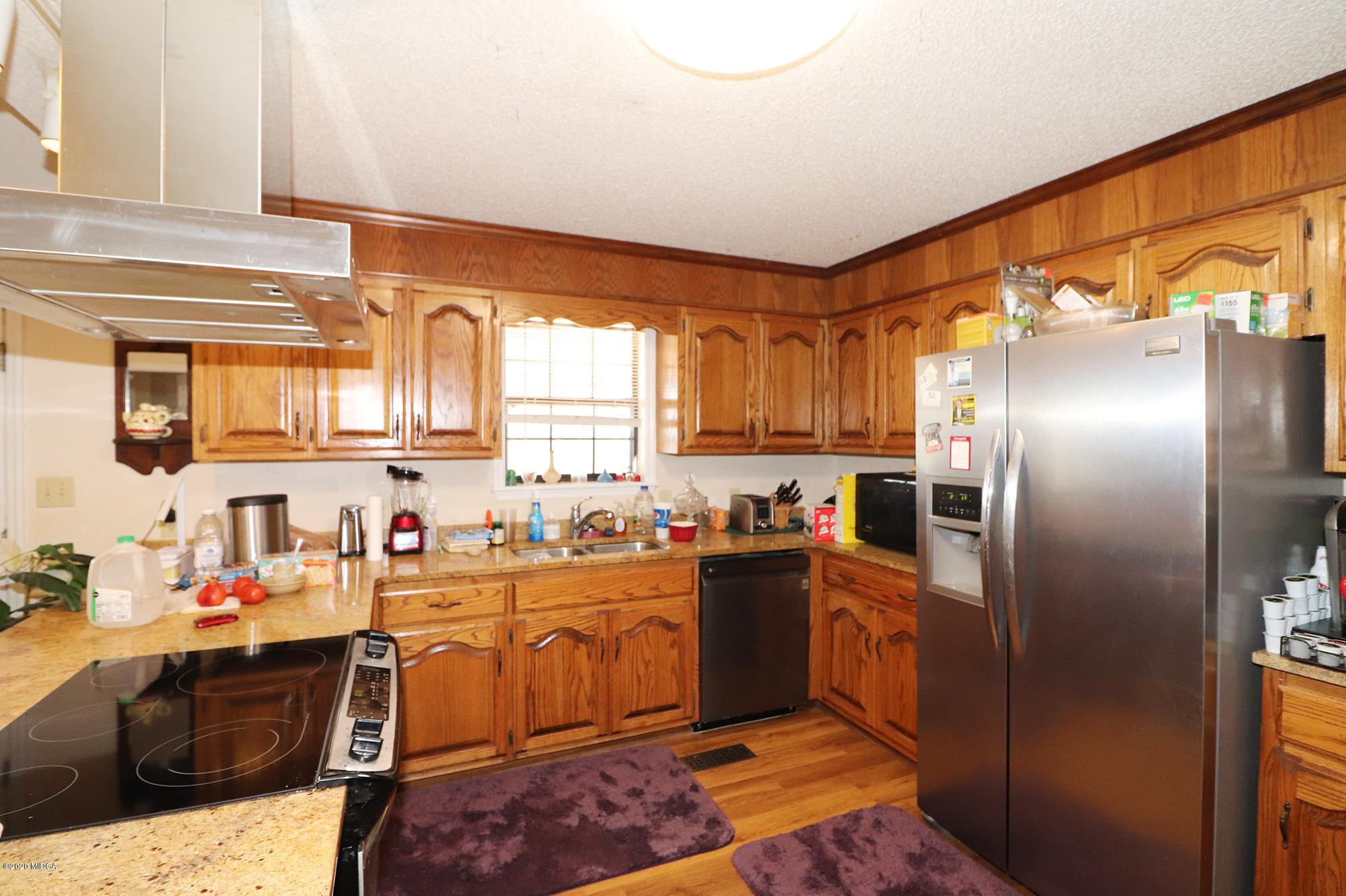 48 Grace Road Knoxville, GA 31050 - Photo 7 of 62 a kitchen with stainless steel appliances granite countertop a sink stove and refrigerator