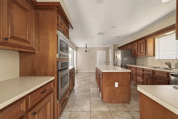 a view of walk in closet with wooden floor