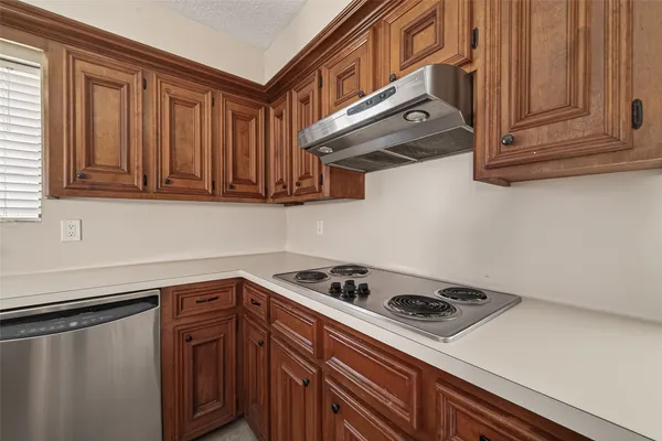 a view of a backyard with wooden fence