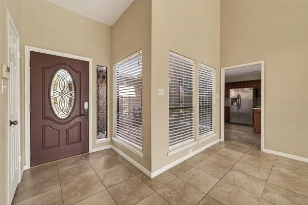 a kitchen with stainless steel appliances granite countertop a sink counter space cabinets and a large window