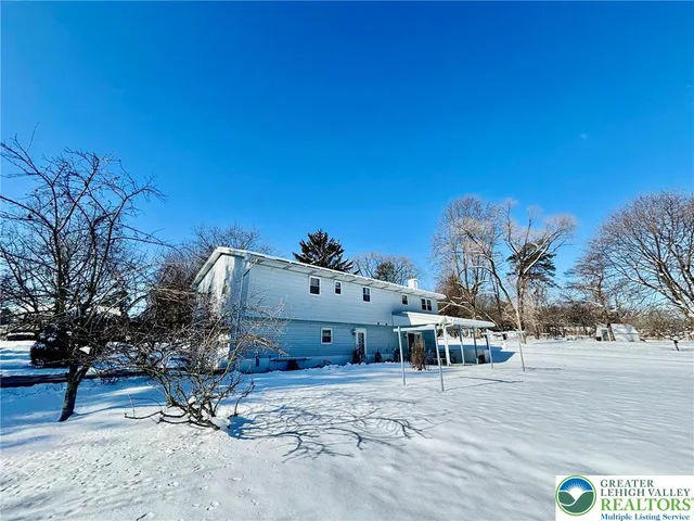 a view of a house with a snow